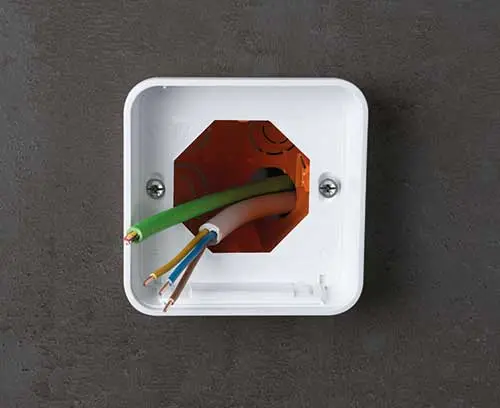 Bottom part of the enclosure S84 screwed onto the switch box